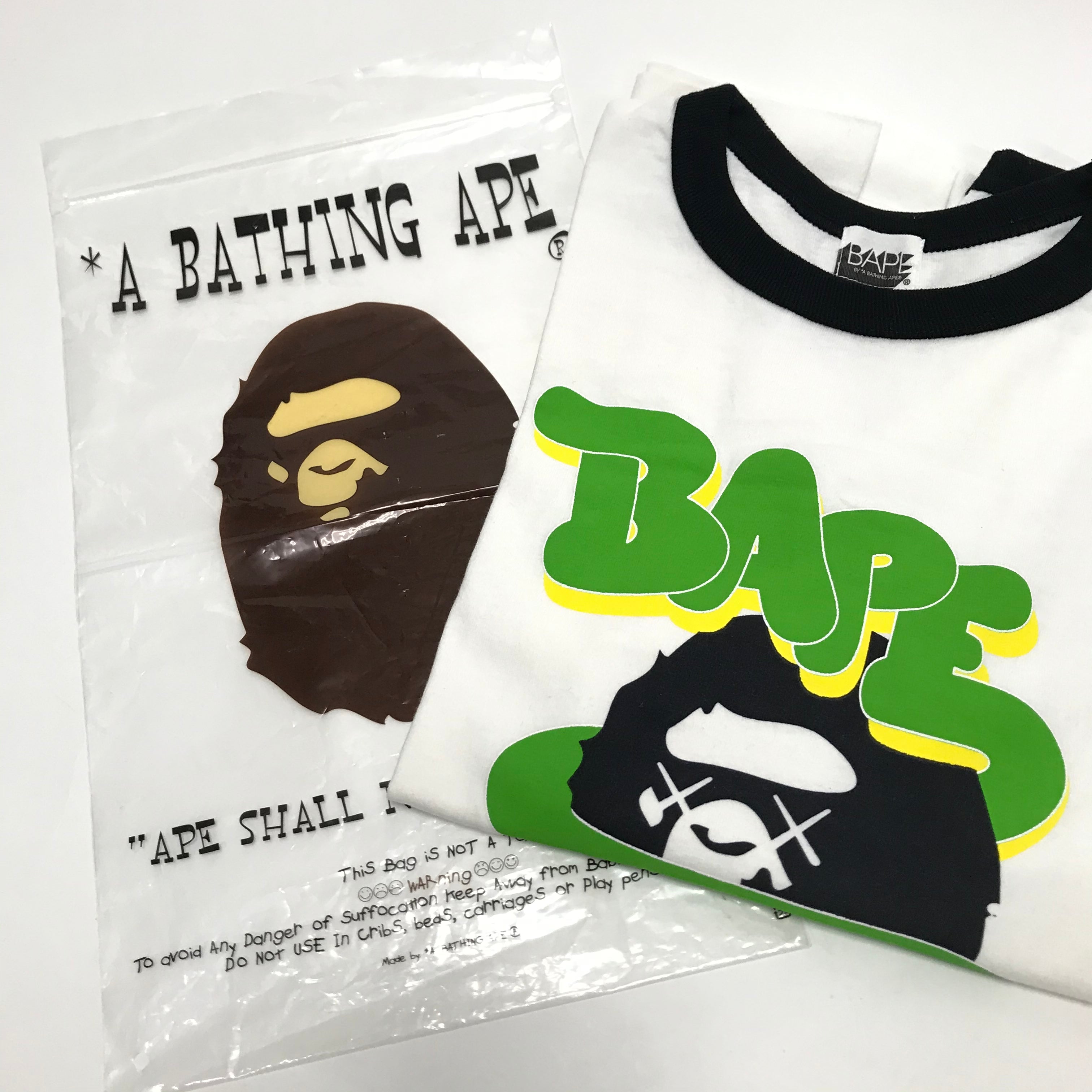 S] A Bathing Ape Bape x Kaws Logo Ringer L/S Tee White